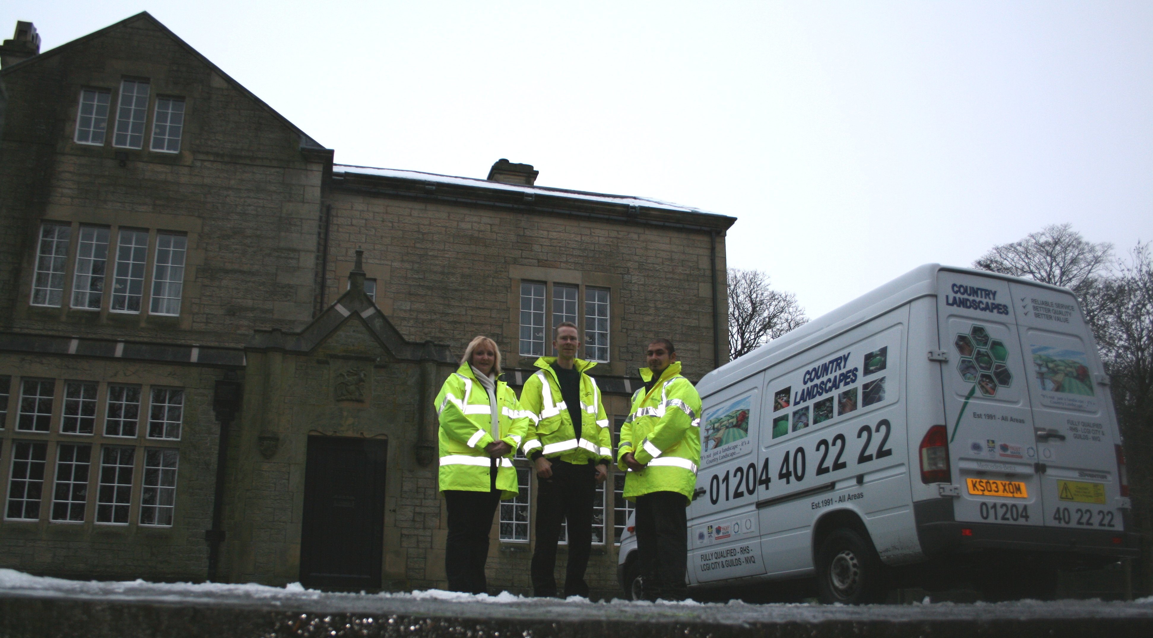 some of the team who worked at Tor Side including Anita Lee and Mick pictured with new van signage and logo